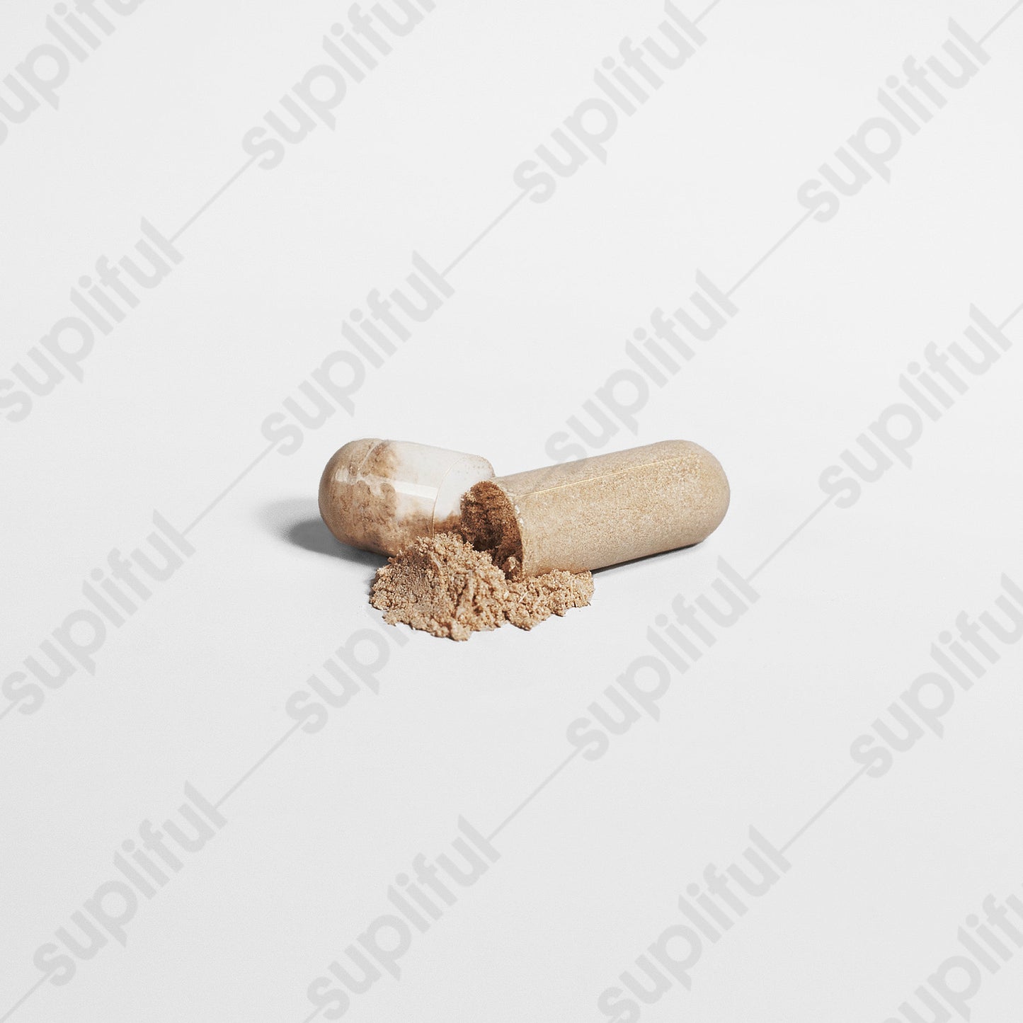 Maca Plus supplement capsule spilled with powder, promoting energy, stamina, and vitality.