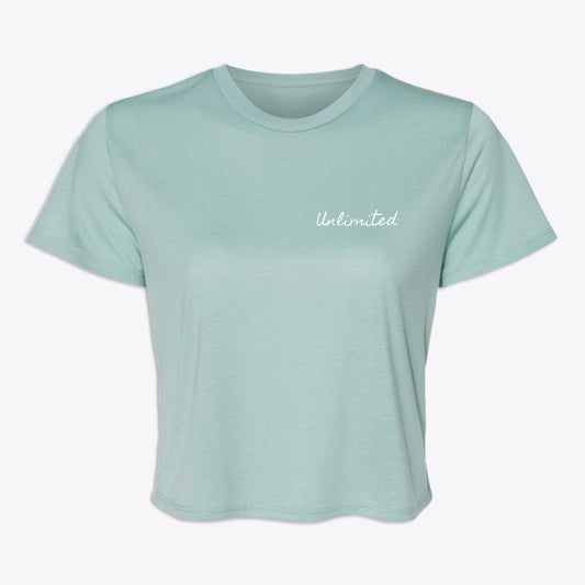 EverStrong Unlimited Womens Flowy Crop Tee in dusty teal featuring a stylish 'Unlimited' print on the front.